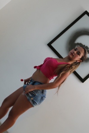 Sofia Perez enjoys sucking her lollipop & striping naked