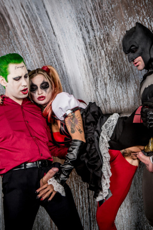 Superhero Kleio Valentien sandwiched between Joker and Batman