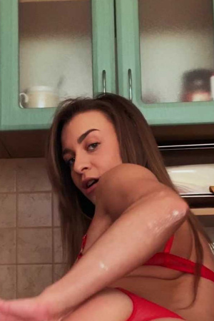 Josephine Jackson fingers her bald pussy in the kitchen