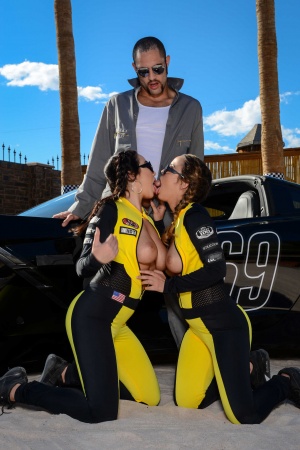 Dillion Harper & Karlee Grey have a trio with the tow guy over the race car