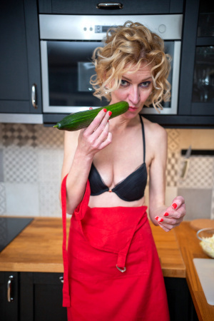 Hot mama Peggy gets busy in the kitchen