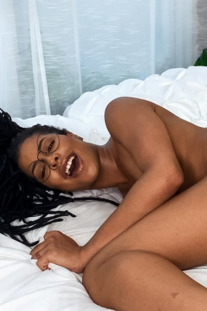 Sweet ebony Kira Noir has fun with sex toys