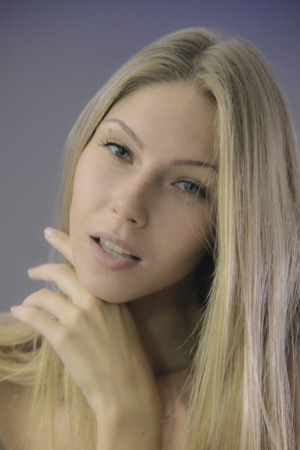 Slender and charming Angelica shows off her body