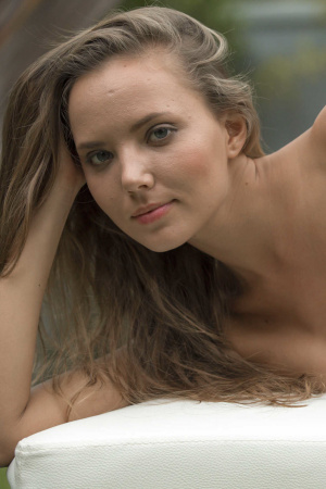 Petite young Clover shows off her body