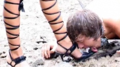 Leashed slaves tongue cleaning dirty shoes outdoors